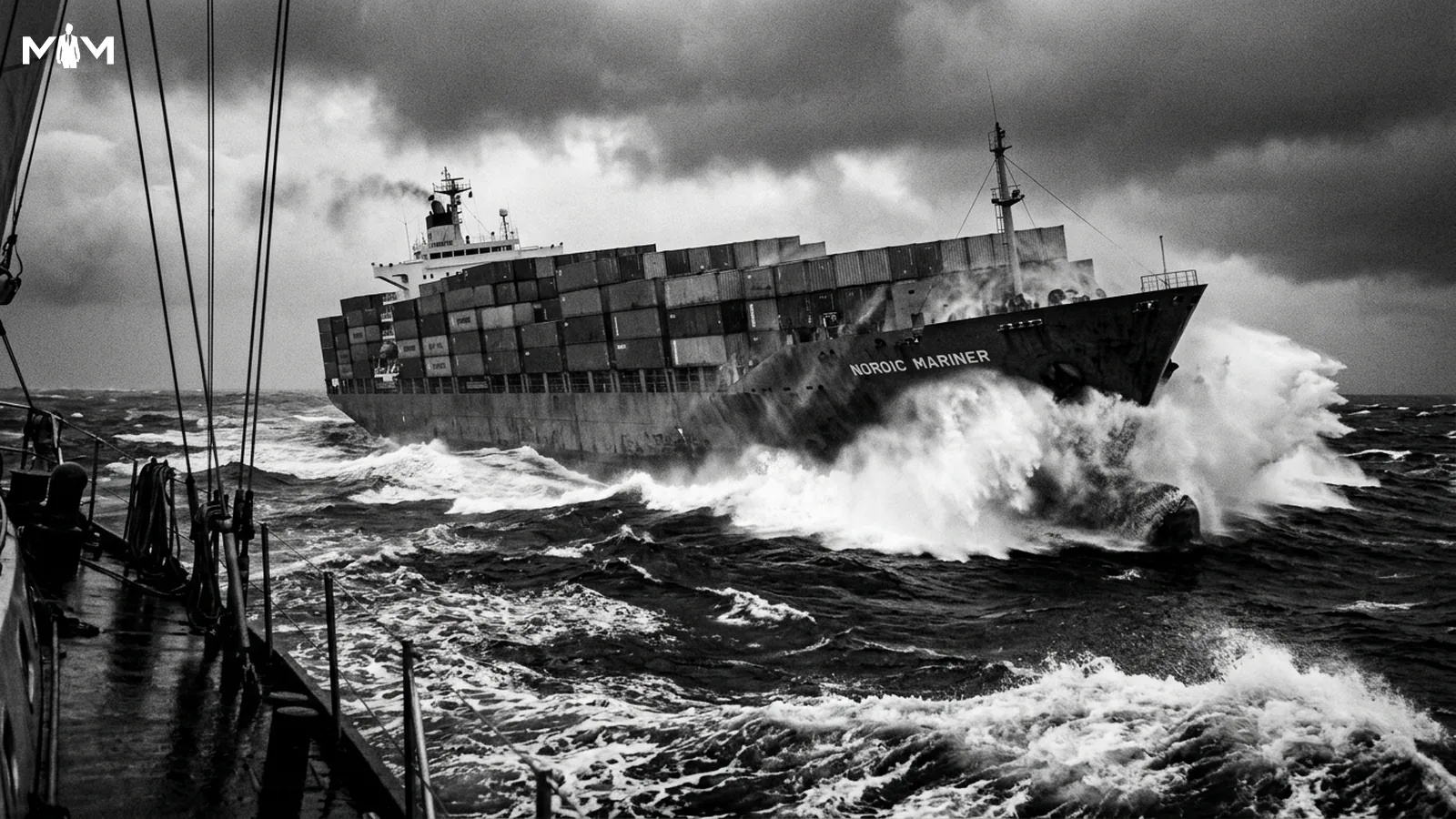 Cargo ship in heavy rolling seas under dark storm clouds shot from a following vessel at water